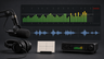 A clean recording-level display with green and yellow meter bars stopping safely below a red zone, with a microphone and waveform nearby.